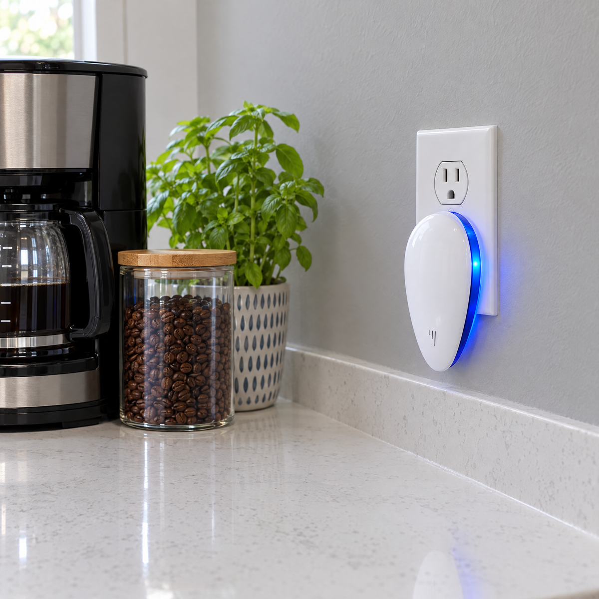 Repeller glowing in a backsplash outlet in a dark kitchen