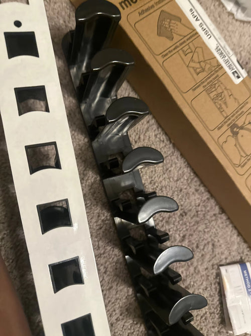 Customer photo of the cap rack mounted on a wall