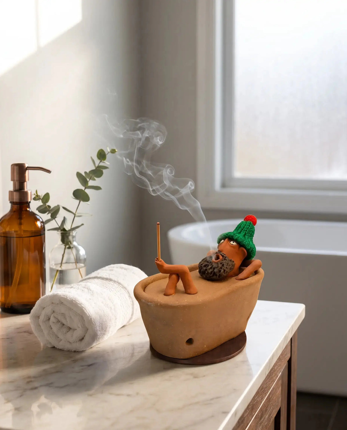 Lazy Bath Man incense burner on a marble bathroom vanity