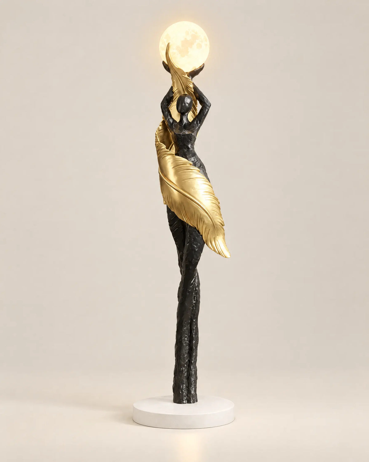 Humanoid sculpture floor lamp in black and gold