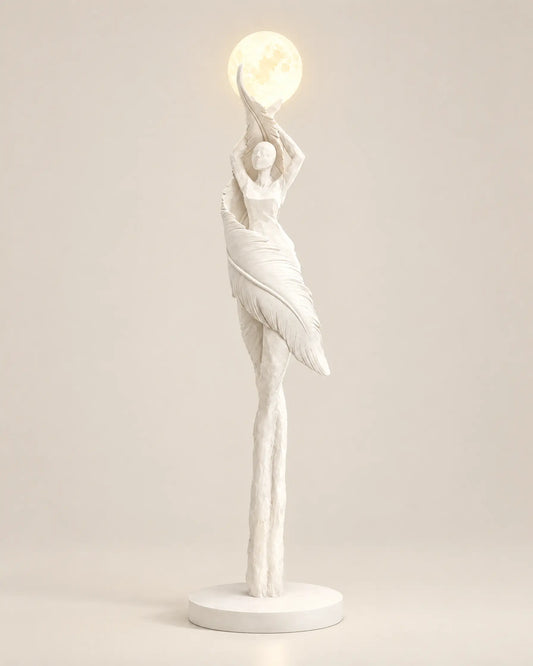 Humanoid sculpture floor lamp in white, switched on